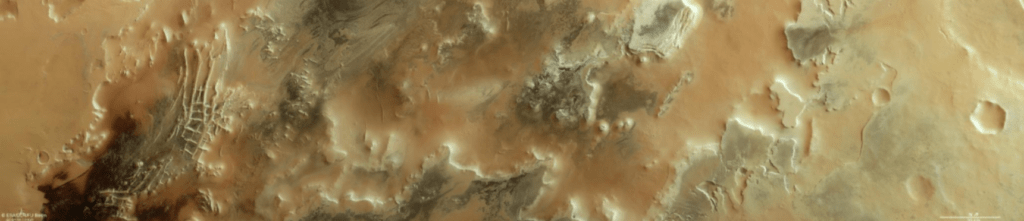 Le macchie scure in questa immagine del Mars Express dell'ESA sono il segno rivelatore della presenza di "ragni", strutture scure nel ghiaccio sparse nella regione polare meridionale del Pianeta Rosso. Credits: ESA/DLR/FU Berlin